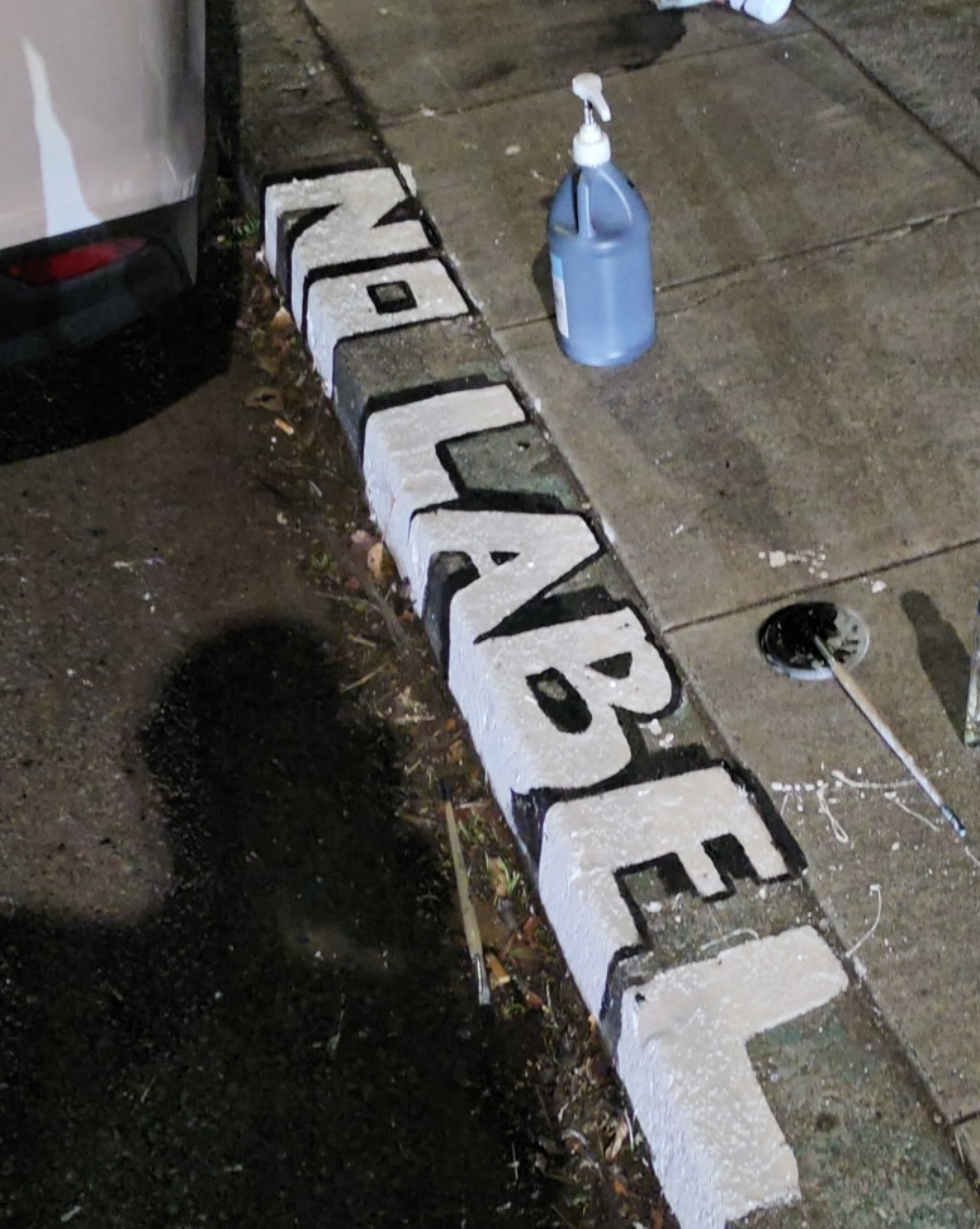 No Label painted along a curb.